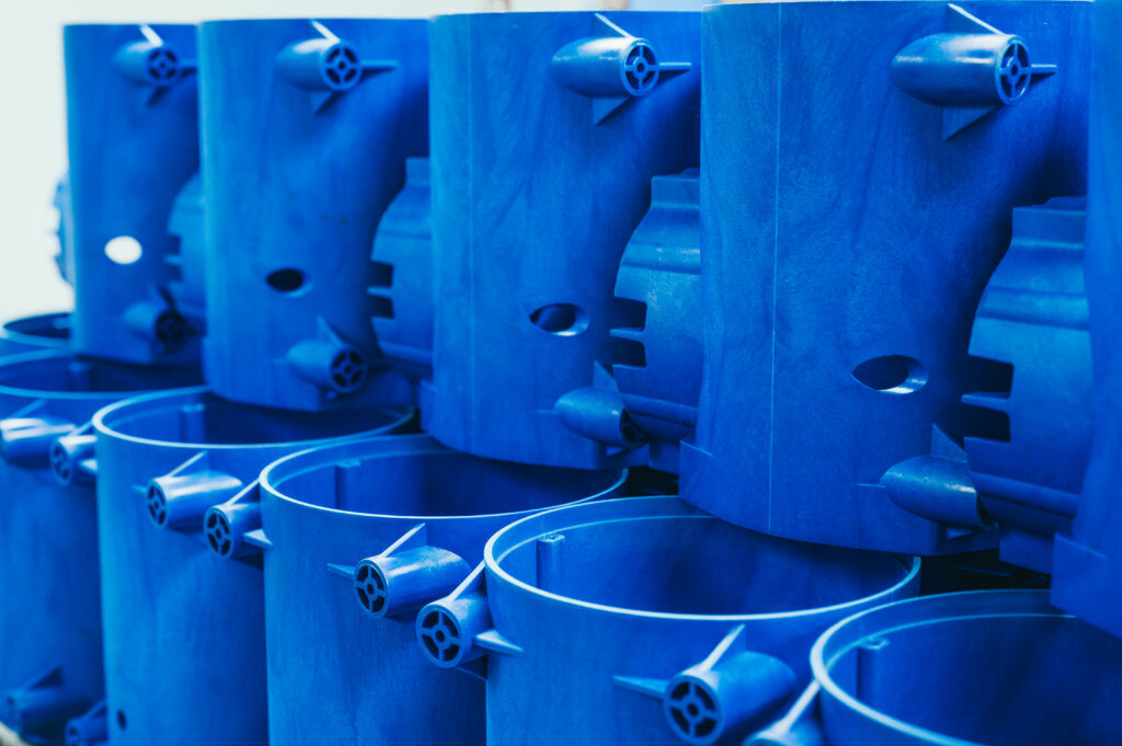 Large blue plastic vats