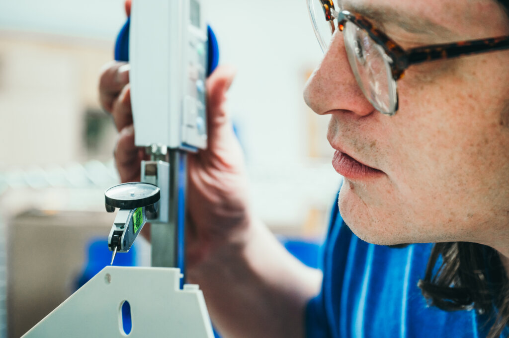 Man examines detailed measurements of product