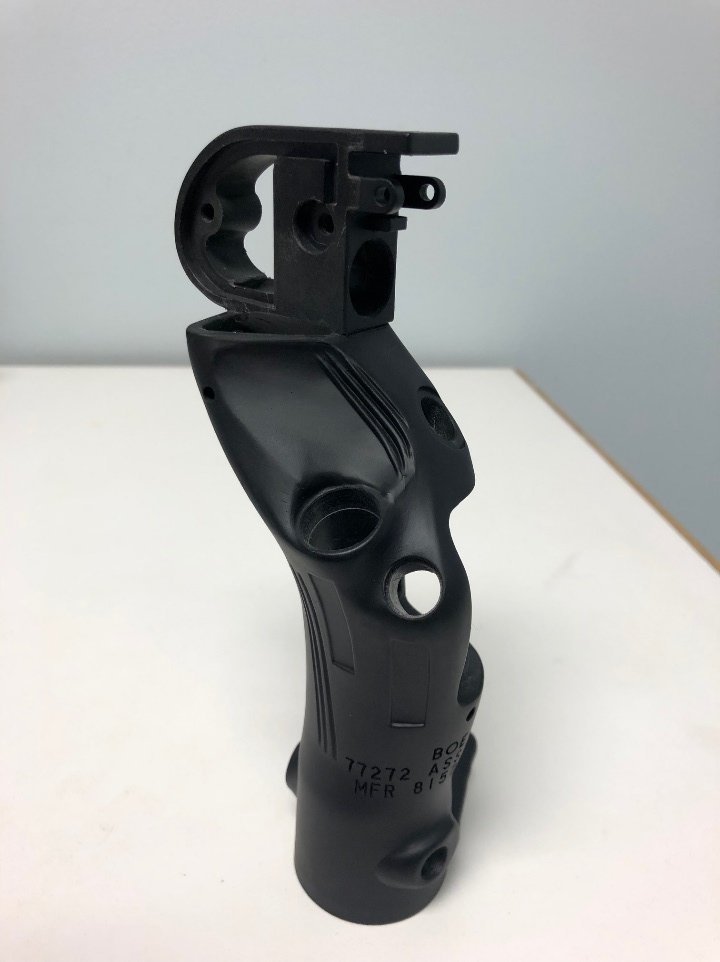 Aerospace grip assembly — precision injection molded component